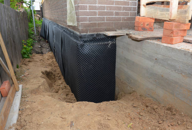 Happy homeowners after waterproofing job in Arpin